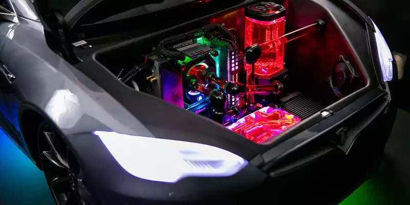 This gaming PC is built into a toy Tesla Model S, and yes, it can drive it.