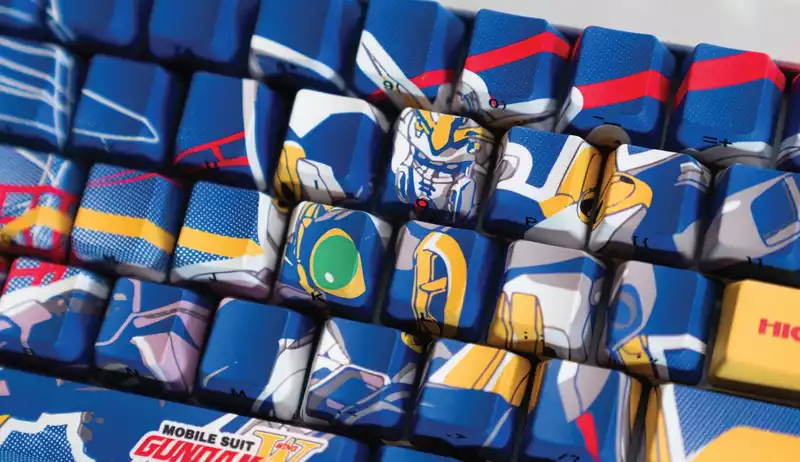 Gundam keyboards with RGB eliminated and 90's mecha printed on them!